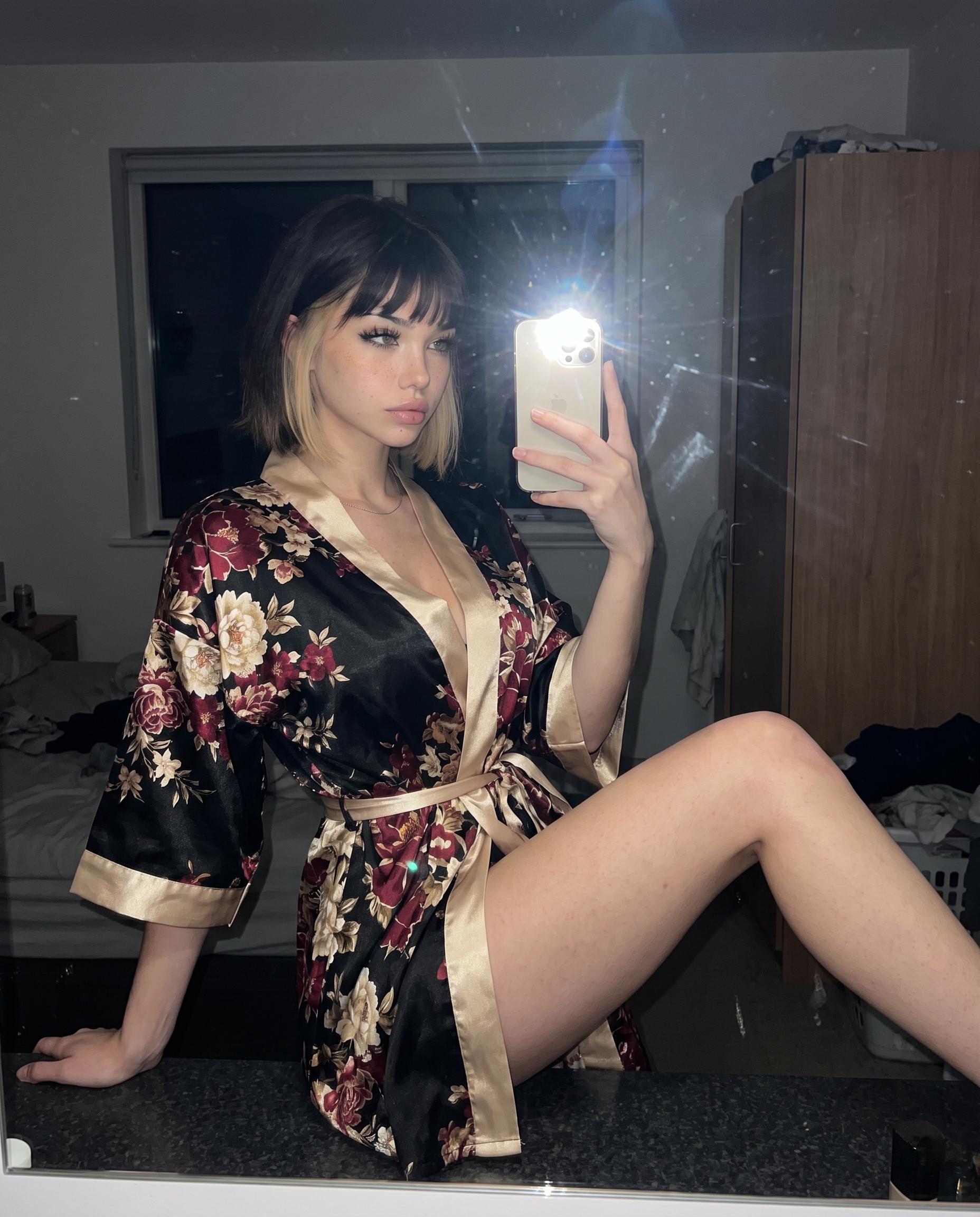Low-light satin robe mirror selfie